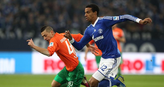 Nikola Djurdjic gives chase with Joel Matip