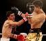 Andrew Selby (l) en route to victory over Meirbolat Toitov
