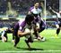 Melbourne celebrate a try on the way to victory over Leeds