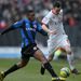 Barnsley's Kelvin Etuhu and Shaun Williams of MK Dons compete for the ball