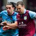 West Ham striker Andy Carroll vies for the ball with Villa's Dutch defender Ron Vlaar in a goalless opening half.