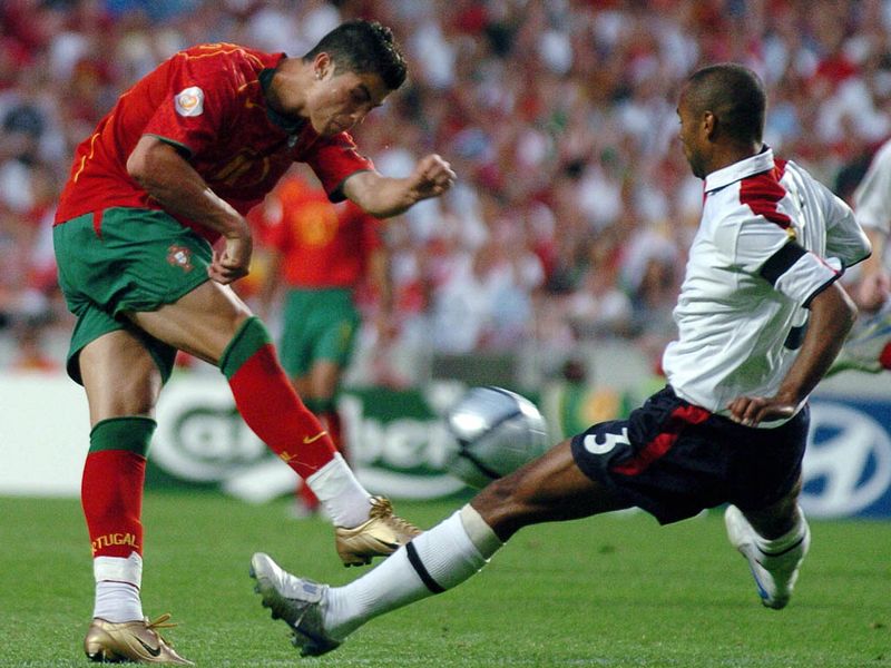 Starting to be acknowledged as the best left back in the world, Cole does a job on Manchester United's Cristiano Ronaldo against Portugal at Euro 2004.