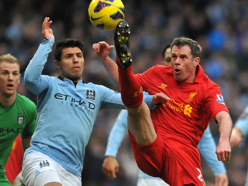 Carragher in action in Liverpool's recent draw with champions Manchester City