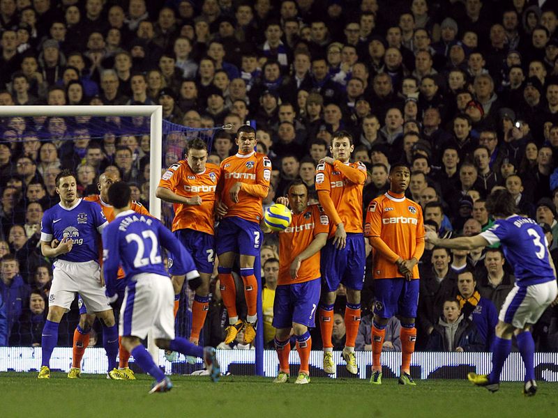 Leighton Baines sees his early free kick hit the Oldham wall