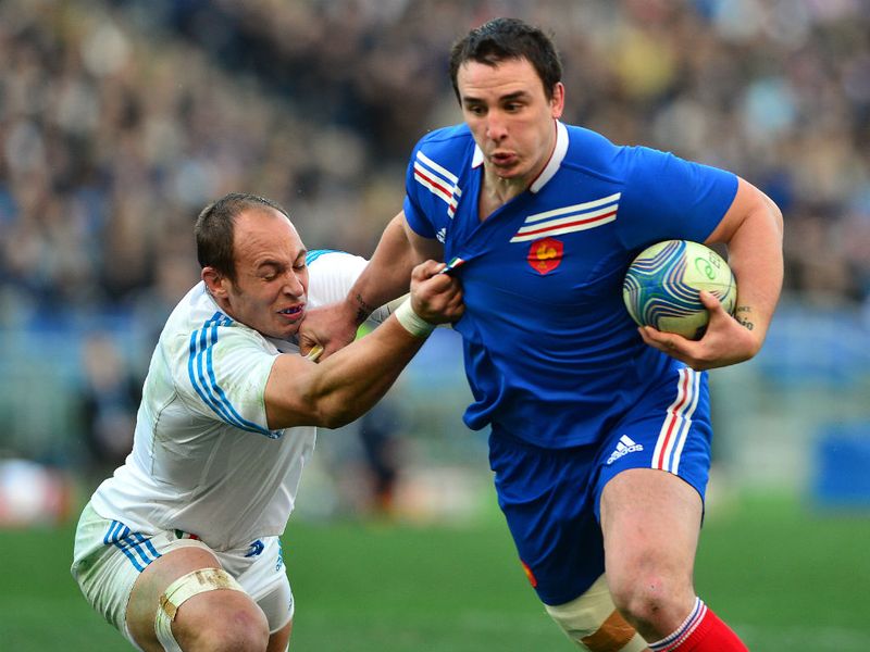 Shirts off: Number eight Picamoles is pulled back by Italian captain Sergio Parisse