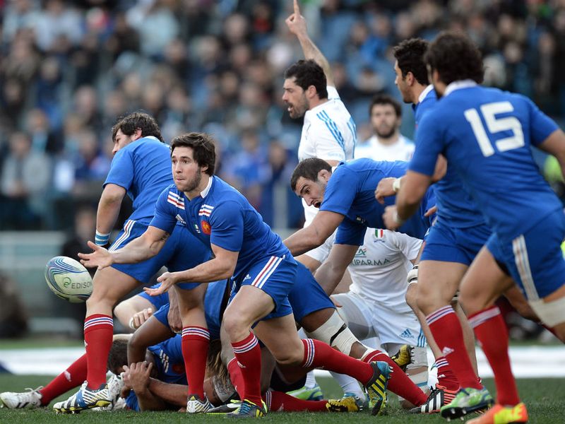 Anywhere will do: France scrum-half Maxime Machenaud clears his lines...