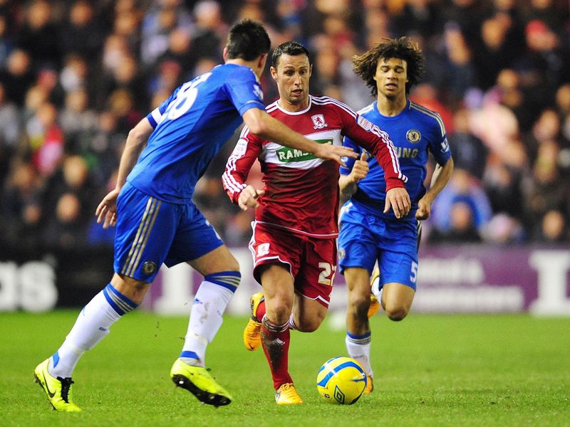 Scott McDonald tries to dribble past Terry as the Championship side look to cause an upset
