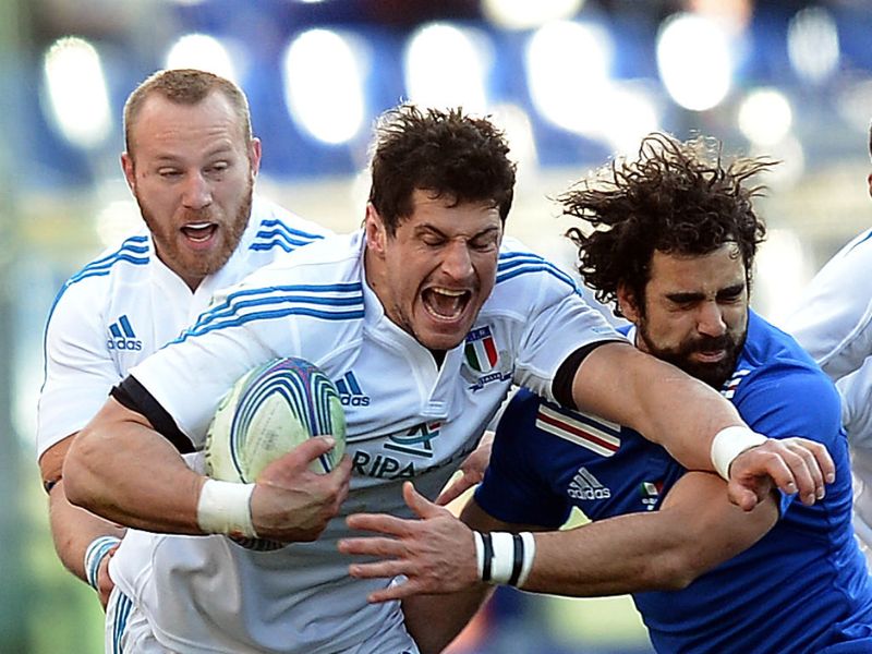 ...as flanker Thierry Dusautoir looks to gets past Alessandro Zanni