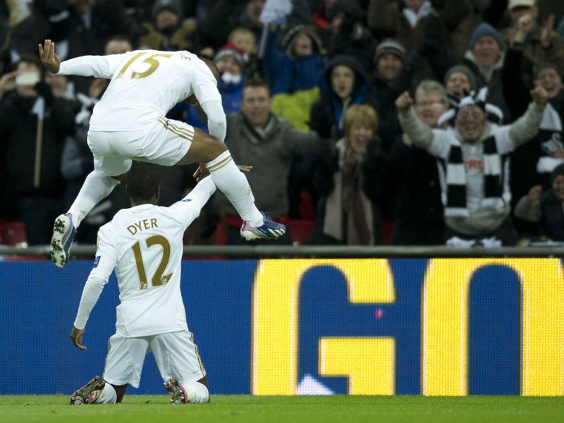 Wayne Routledge celebrates after Nathan Dyer makes it 3-0 to Swansea in the 47th minute