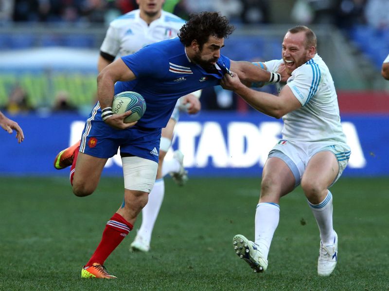 No holds barred: Leonardo Ghiraldini attempts to hold back Frenchman Yoann Huget