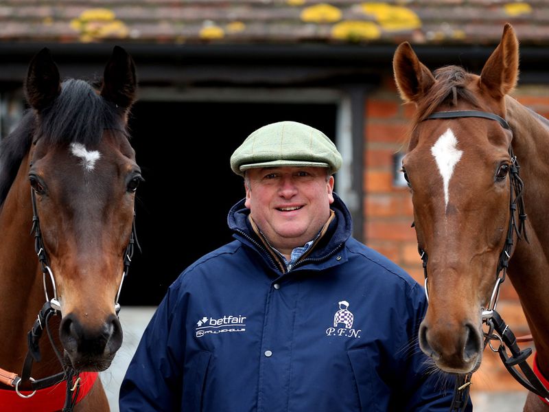 Paul Nicholls and his two stars face the camera