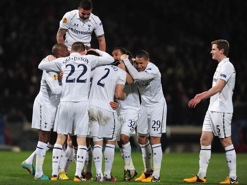 Tottenham celebrate after Mousa Dembele's late goal fires them to a 3-2 aggregate win over Lyon to seal their spot in the last 16.