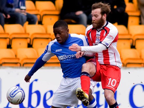 Nigel Hasslebaink and James Dayton battle for the ball