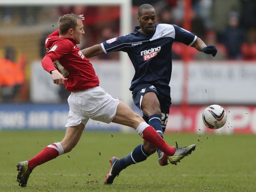 Chris Solly tries to tackle Dany N'Guessan