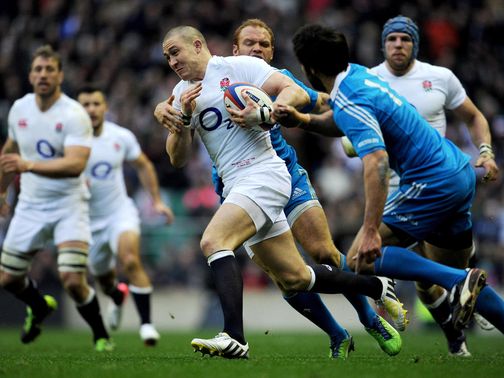 Mike Brown makes a break through the Italian ranks