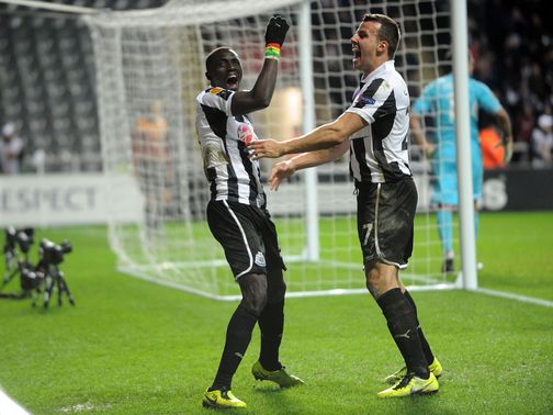 Papiss Cisse celebrates his goal with Steven Taylor