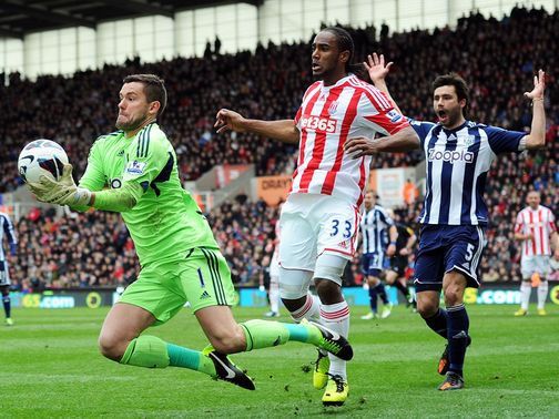 Ben Foster takes the ball under pressure from Cameron Jerome