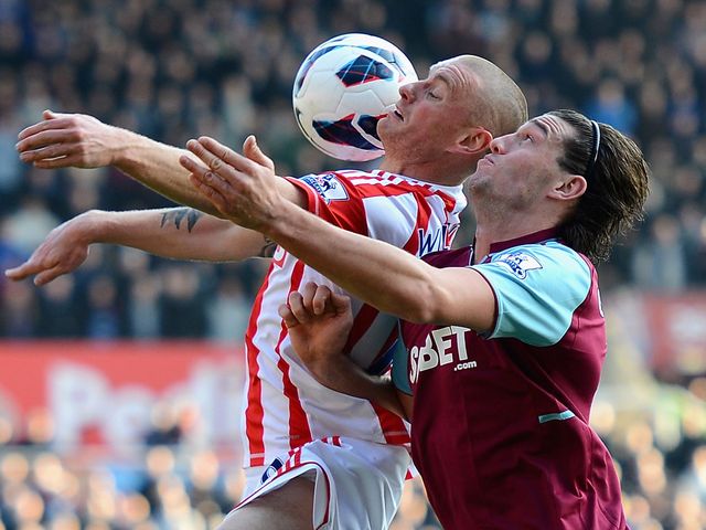 Andy Wilkinson holds off Andy Carroll