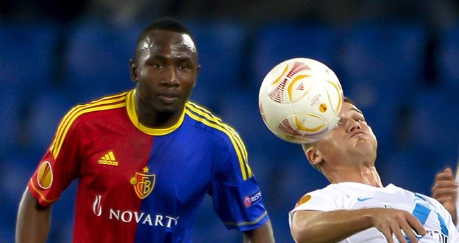 Jacques Zoua and Igor Denisov battle for the ball