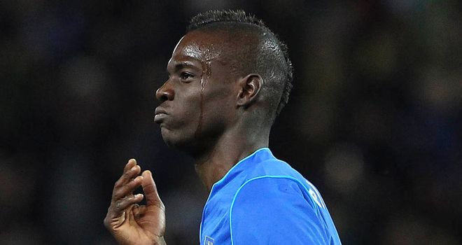 Mario Balotelli: Celebrates his stunning equaliser for Italy