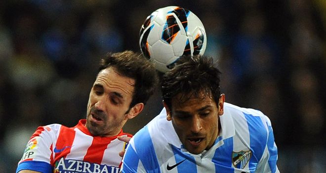 Juanfran and Roque Santa Cruz in aerial battle