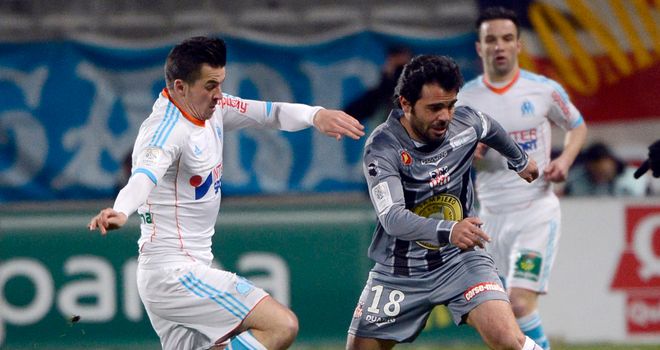 Joey Barton vies with Ajaccio midfielder Johan Cavalli