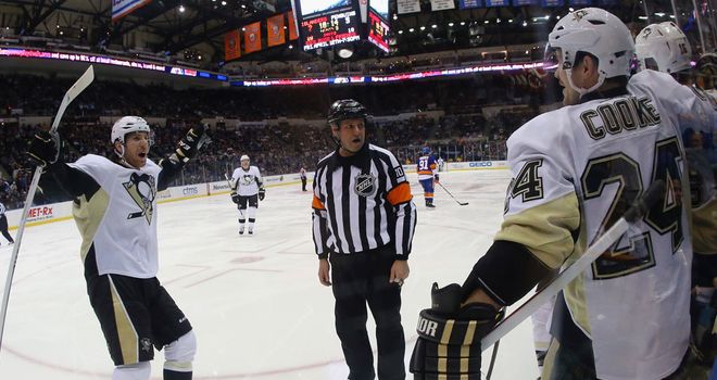 The Penguins celebrate Brandon Sutter's goal.