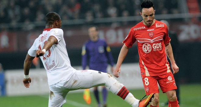 Dijbril Sidibe and Gael Danic tangle.