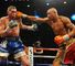 Tony Bellew takes a right hand from Isaac Chilemba on the way to their drawn title eliminator (leighdawneyphotography.com)