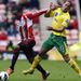 Danny Rose swings his arm back in the face of Elliott Bennett