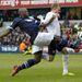 Millwall defender Danny Shittu tackles Blackburn striker Jordan Rhodes at The Den