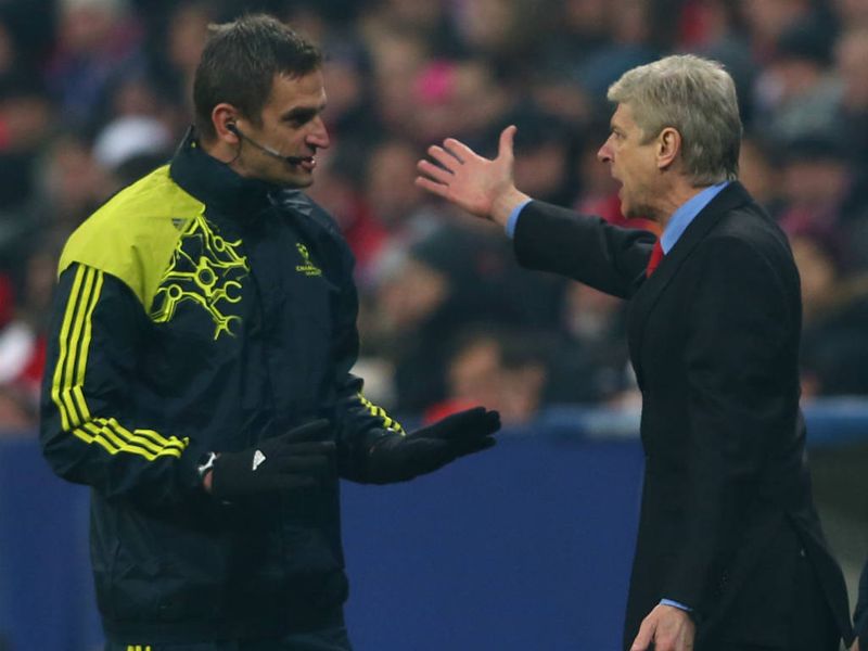 Arsenal boss Arsene Wenger remonstrates with the fourth official during the Champions League tie at the Allianz Arena