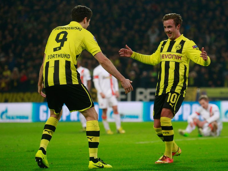 Mario Goetze celebrates Borussia Dortmund's second goal with Robert Lewandowski against Shakhtar.