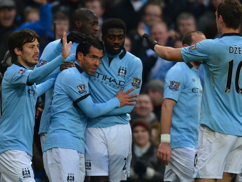 Tevez is congratulated after breaking the deadlock