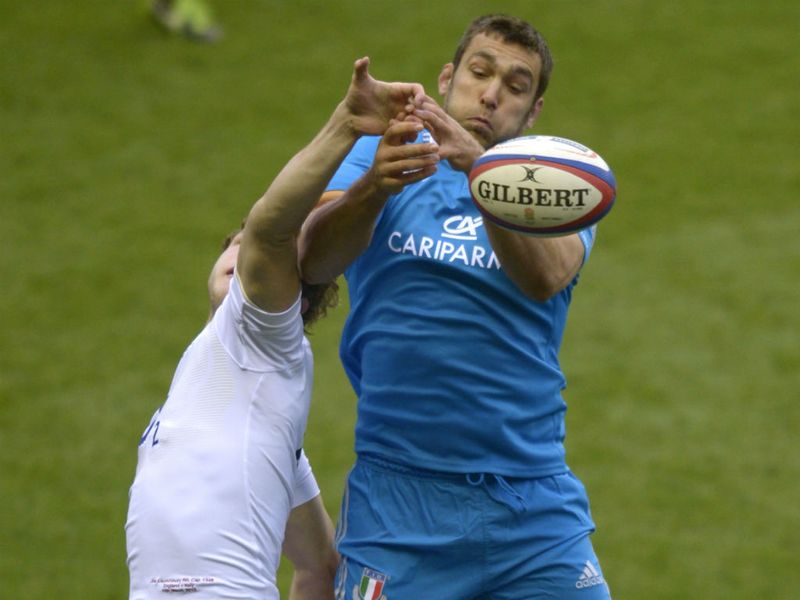 Early action: England's lock Joe Launchbury and Italy's lock Quintin Geldenhuys vie for the ball