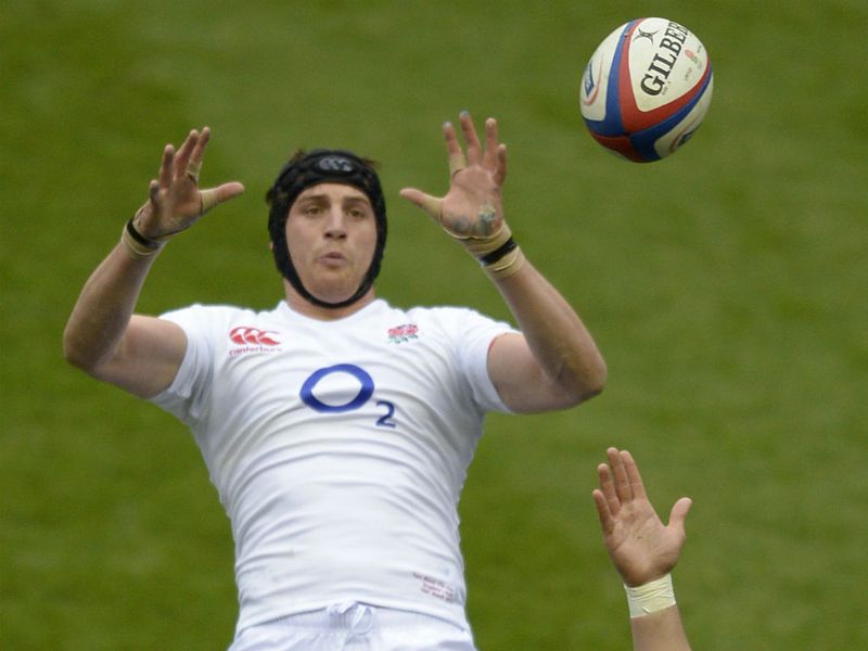 Keeping focus: England's Number Eight Tom Wood is hoisted up to claim the ball