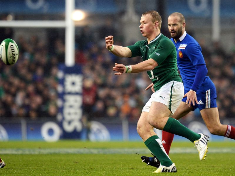 Spreading the play: Ireland centre Luke Marshall passes the ball in front of France fly-half Frederic Michalak