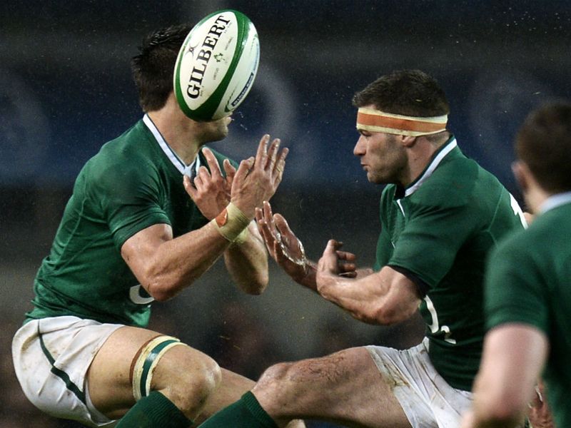 Flying high: Ireland's fly-half Paddy Jackson and outside centre Brian O'Driscoll jump for the ball