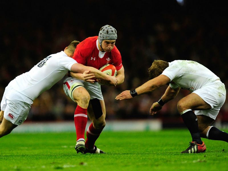 Busy defending: Owen Farrell and Tom Youngs are back tackling Jonathan Davies