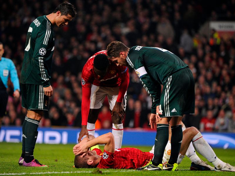 Nemanja Vidic is hurt after clashing with Real Madrid goalkeeper Diego Lopez.