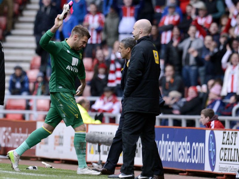 ... before their goalkeeper Mark Bunn is sent-off for a handball incident outside his area