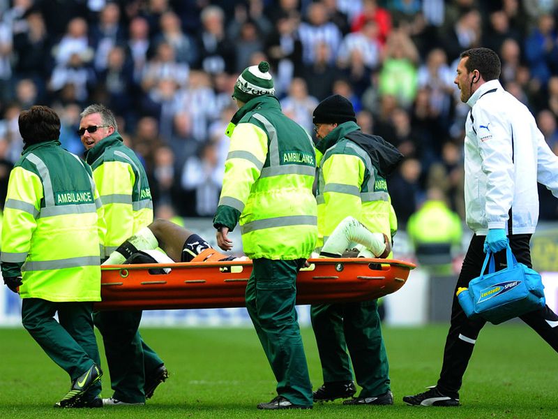 Massadio Haidara is carried from the field on a stretcher after a nasty tackle