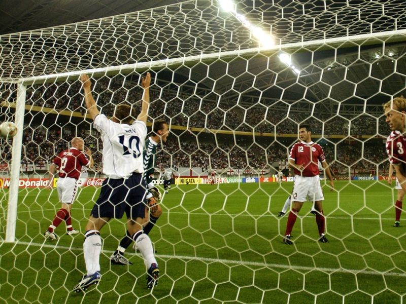 Ferdinand claims the opening goal of England's 3-0 win over Denmark in the second round of the 2002 World Cup