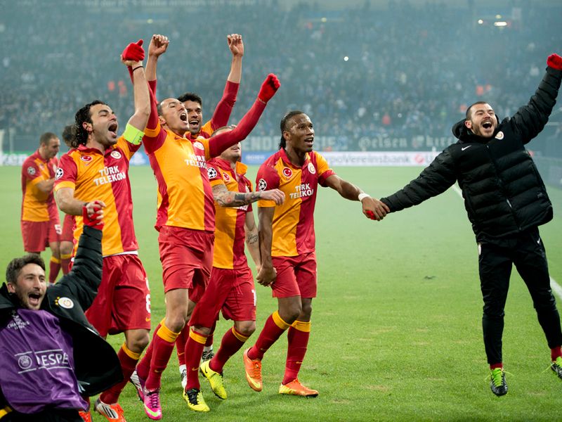 The Turkish side celebrate their 3-2 win on the night which sent them through 4-3 on aggregate