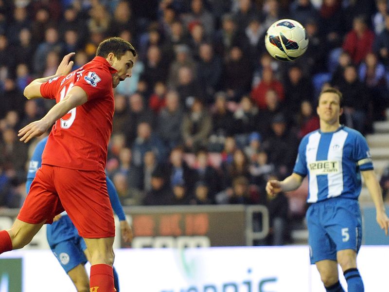 Stewart Downing heads Liverpool into the lead at Wigan