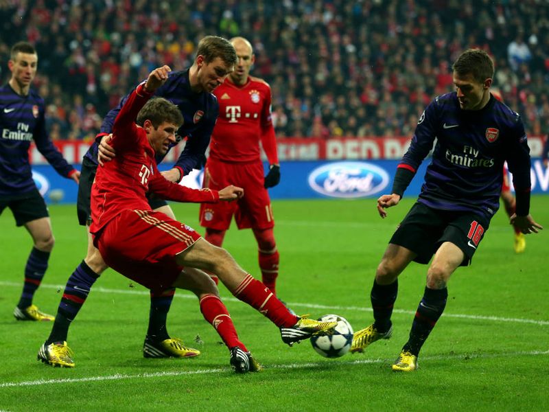 Thomas Muller is crowded out by Arsenal players during Bayern Munich's Champions League last-16 tie