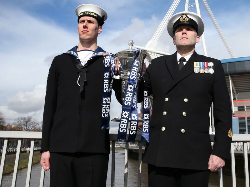 Stand to attention: Warrant officer and able seaman escort the trophy to the Millennium Stadium