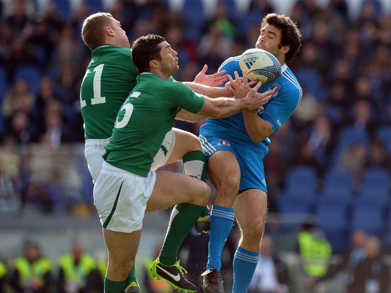 Giving their all: Italy's Luke McLean catches the ball in front of Ireland's Keith Earls and Robert Kearney (centre)