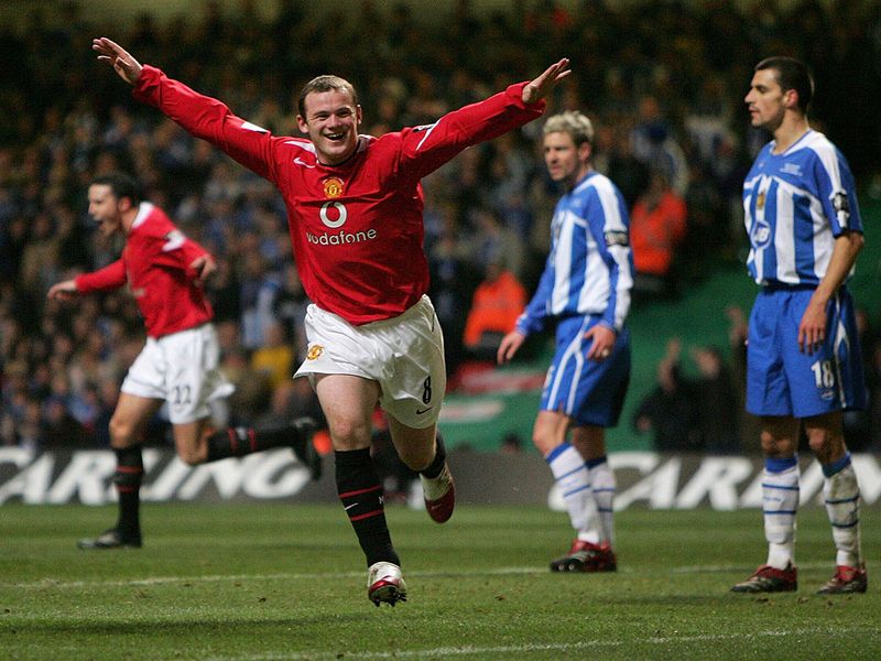 The Manchester United striker scores twice as they beat Wigan 4-0 in the Carling Cup final, leading to Rooney's first senior trophy.