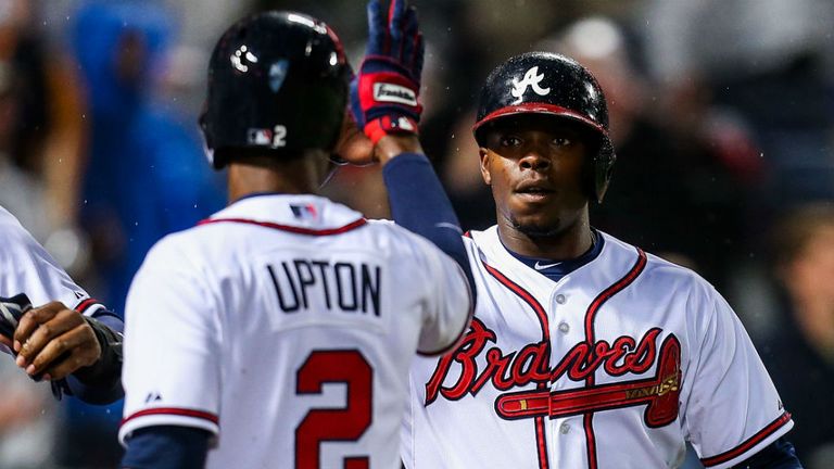 BJ and Justin Upton celebrate as the Braves win